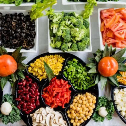 Colorful array of fresh vegetables and legumes like broccoli, chickpeas, beans, and peppers—nutrient-rich ingredients ideal for NMN-boosting recipes.
