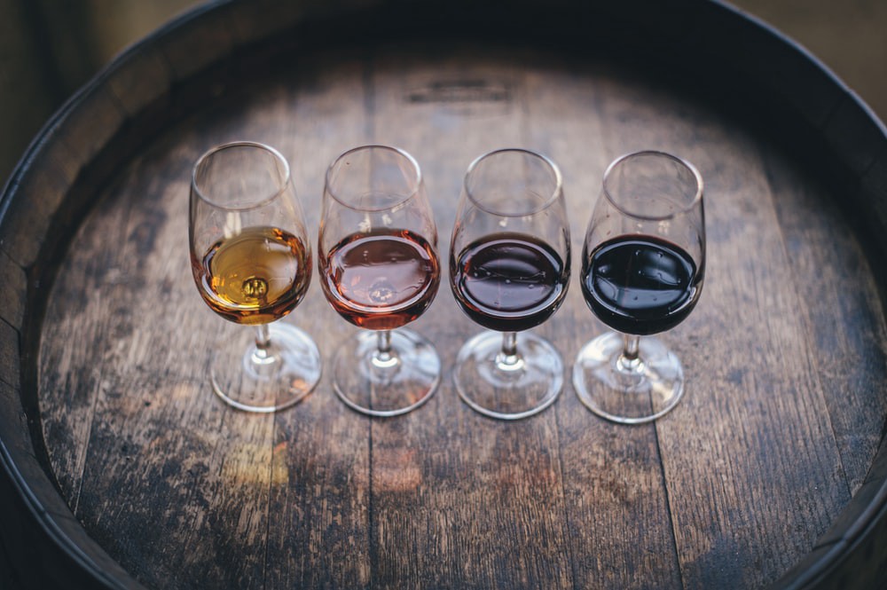 Four glasses of different wines. 