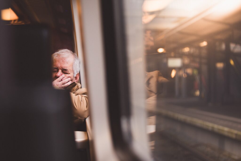 Elderly person sleeping while commuting